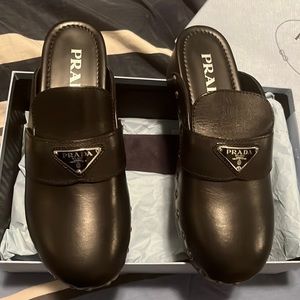 Authentic Prada clogs never worn,box (Few stains)&duster bags included